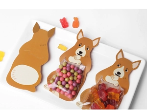 Corgi cartoon paper cards holding transparent candy bags with colorful sweets inside