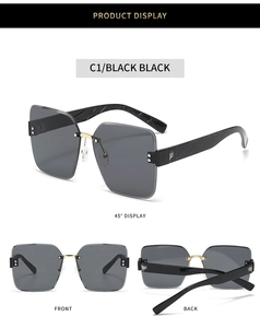 Detail of rimless square sunglasses with textured black temples and gold metal bridge