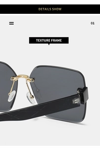 Close-up of golden nose bridge and textured black frame on rimless square sunglasses