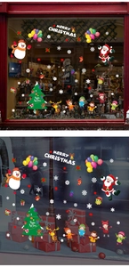 Detail of Christmas window stickers featuring Santa, snowman, and reindeer festive designs