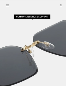 Detail of comfortable silicone nose pads and golden metal bridge on rimless square sunglasses