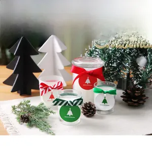 Close-up of green star tree tags with Merry Christmas text on eco-friendly coated paper