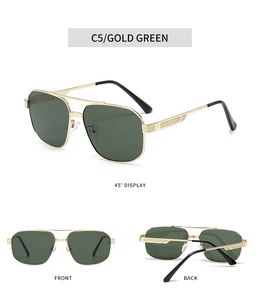 Detailed view of gold pilot sunglasses with green lenses and textured metal temples