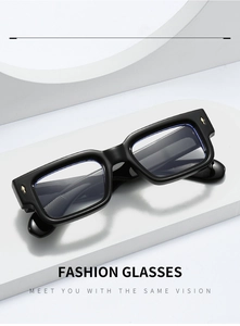 Detailed close-up of glossy black rectangular frames with gold diamond accents and blue light lens