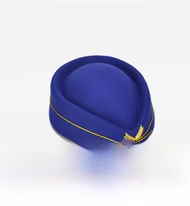 Detail view of the navy blue wool pillbox hat featuring gold braid and wheat emblem