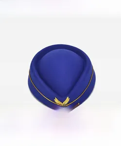 Front view of a blue wool pillbox hat with gold wheat badge and trim for uniforms