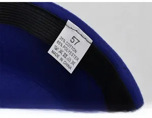 Detail view of flight attendant hat interior with black sweatband and 57cm size label