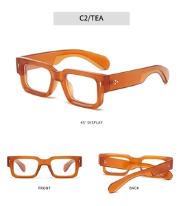 Detailed views of amber tea thick rectangle glasses frames with metal arrow rivets