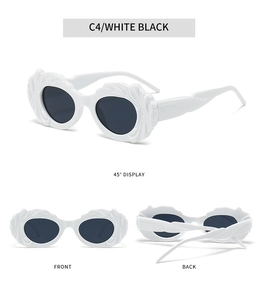Détail de lunettes de soleil blanches en forme de nuage avec textures ondulées