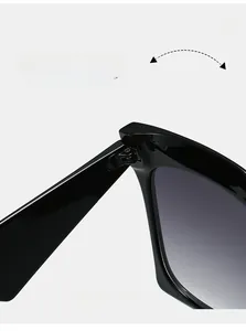 Close-up of durable metal hinge on black wide-frame square fashion sunglasses
