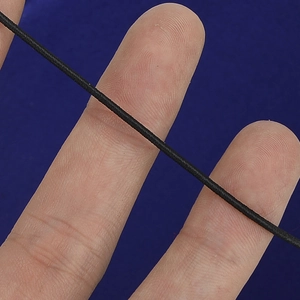 Close-up of black elastic cord showing stretch texture and braided fiber detail