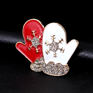 Christmas glove brooch set with gold snowflakes and rhinestones on black background
