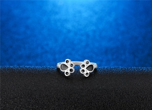 S925 silver cat paw open ring featuring black enamel footprints on a polished band
