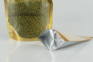 Golden stand-up pouch with window showing expandable bottom and green bean storage