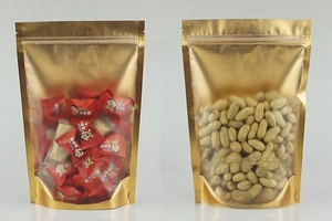 Detailed view of gold stand-up pouches with transparent window for food packaging