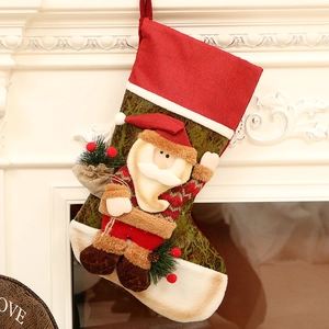 Linen Christmas stocking with Santa applique hanging on a white fireplace mantel