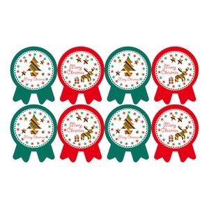 Red and green Christmas gift seal stickers with Merry Christmas greeting in round badge style