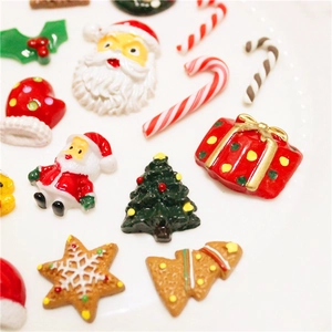 Assorted Christmas resin charms featuring Santa, tree, and candy cane for DIY crafts
