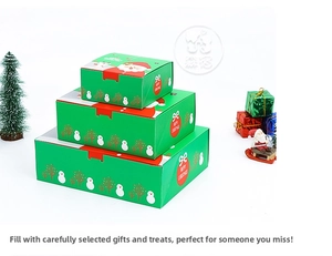 Three-piece set of festive green Christmas gift boxes in various sizes with Santa design