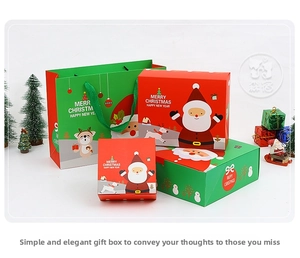 Detailed view of red and green Christmas gift boxes with festive Santa and reindeer designs