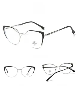 Detail view of cat-eye silver metal frames with black browline and anti-blue light lenses