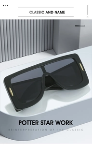 Detailed view of black oversized square sunglasses with stylish gold rivet decorations