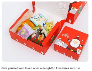 Close-up of red Merry Christmas gift boxes in two sizes with Santa Claus illustration