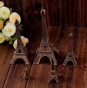 Detailed view of vintage bronze Eiffel Tower models in various sizes for home decor