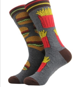 Detail of grey cotton socks featuring fast food burger and fries pattern with stripes