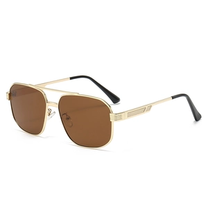 Classic aviator sunglasses with gold metal frame and brown lenses at a 45-degree angle