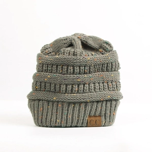 Detail of grey confetti knit beanie featuring a brown C.C brand leather patch and thick ribbing