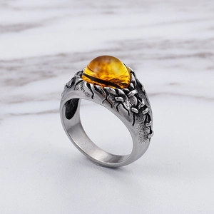Vintage style titanium steel ring featuring an amber gemstone with a 45-degree side view