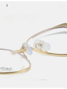 Macro detail of comfortable clear silicone nose pads on gold metal glasses frame