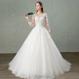 Detail of elegant lace embroidery on long sleeve bodice of white ball gown wedding dress