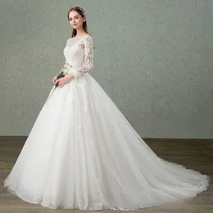 Detailed side view of white lace wedding dress with long sleeves and elegant floral patterns