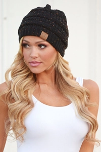 Detail of black cable knit beanie with multi-color speckles and brown C.C leather patch