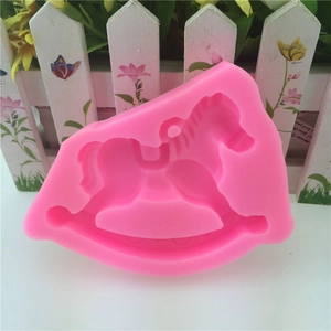 Detail view of pink food-grade silicone mold in classic rocking horse shape for DIY crafts