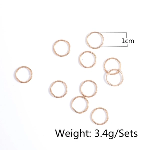 Detail of 1cm golden DIY hair braid rings with 3.4g weight specification on white background