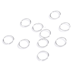 Macro shot of ten silver circular metal jump rings for DIY hair braid jewelry styling