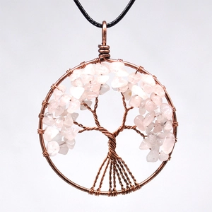 Detail of tree of life pendant with handmade bronze wire wrapping and rose quartz stone