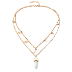 Detail of layered gold necklace with star charms, moon, and white hexagonal stone pendant