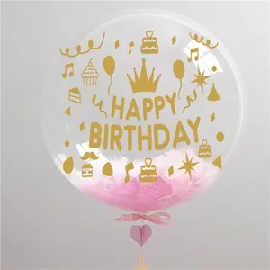 Golden Happy Birthday bobo balloon with pink feathers and ribbon for party decor