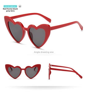 Three-angle display of heart-shaped sunglasses with red frames and grey lenses