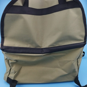 Close-up detail of durable khaki Oxford cloth texture on a breathable pet car travel bag