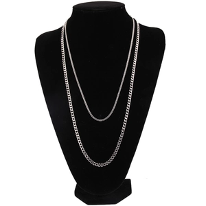Detail view of 3mm silver double layered stainless steel Cuban chain on a black bust