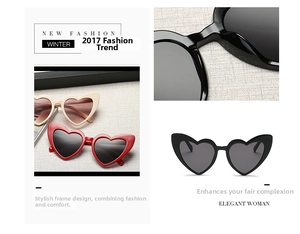 Detail view of heart-shaped sunglasses in red, white and black colors with thick frames