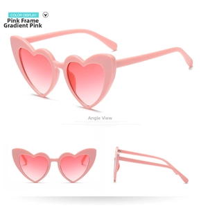 Multiple views of heart-shaped sunglasses with pink frames and gradient pink lenses