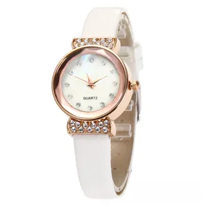 Detailed close-up of rose gold watch case with crystal bezel and mother of pearl dial