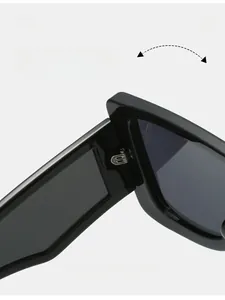 Detail of durable texture hinge on black oversized square futuristic sunglasses