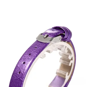 Detailed view of purple faux leather watch strap with silver buckle and glossy texture